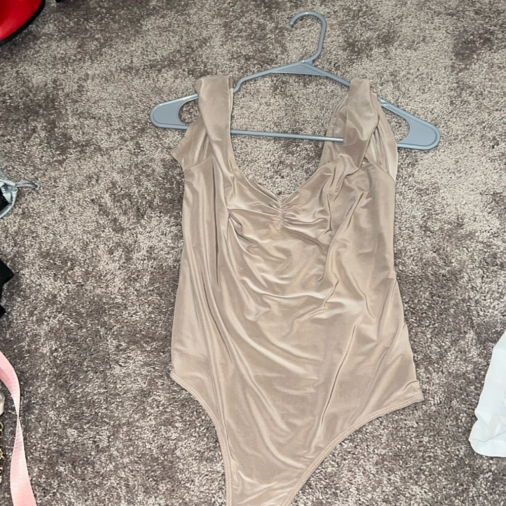 Brown body suit